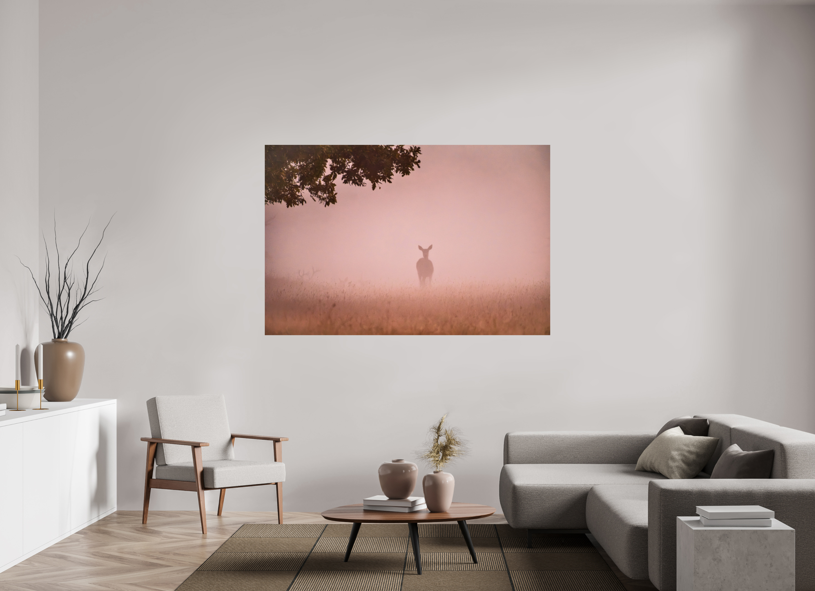 Living room with a large wall art print of a deer silhouette against a pink sky.